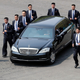 North Korean security persons run by a car carrying North Korean leader Kim Jong Un return to the North side for a lunch break after a morning session of a summit meeting with South Korean President Moon Jae-in at the border village of Panmunjom in Demilitarized Zone Friday, April 27, 2018. Their discussions will be expected to focus on whether the North can be persuaded to give up its nuclear bombs. (Korea Summit Press Pool via AP)